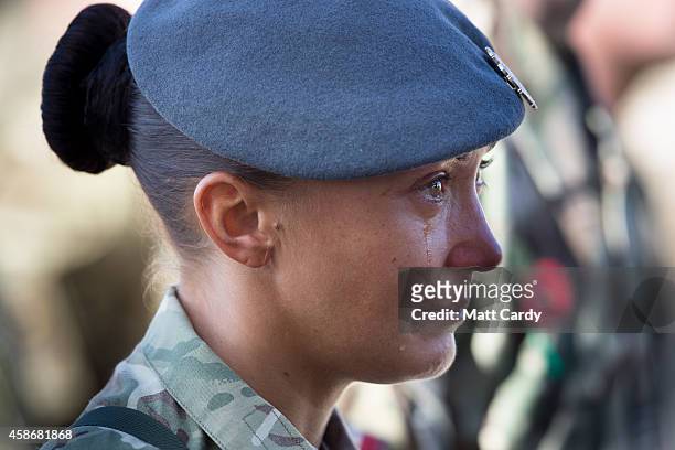 Sgt Khym France reacts as she attends a Remembrance Sunday service for British troops and service personal still remaining in Afghanistan at Kandahar...