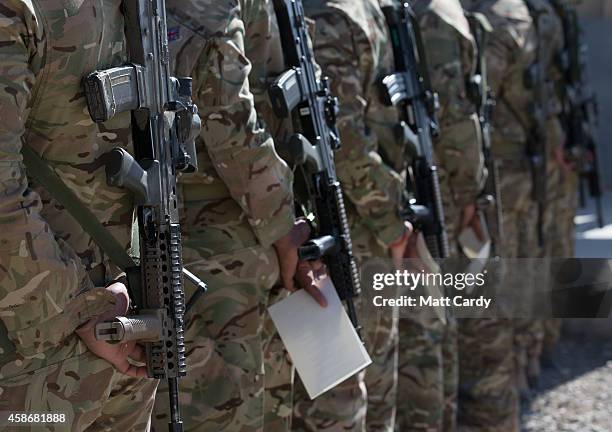 British troops and service personal remaining in Afghanistan are joined by International Security Assistance Force personnel and civilians as they...