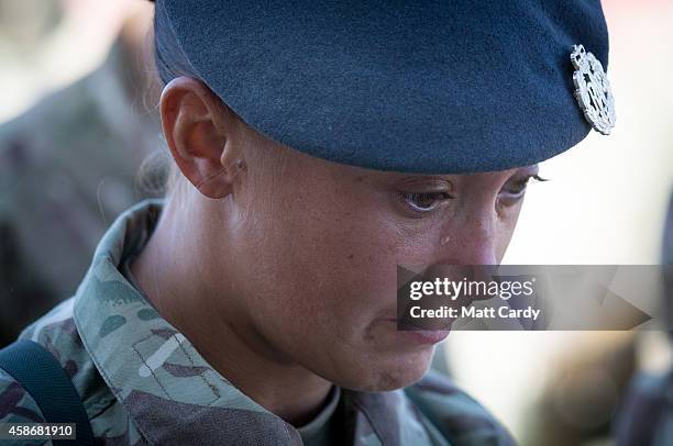 Sgt Khym France reacts as she attends a Remembrance Sunday service for British troops and service personal still remaining in Afghanistan at Kandahar...