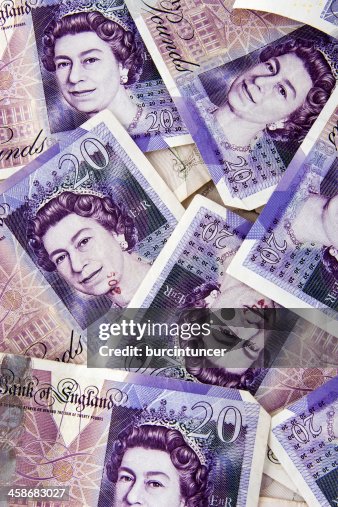 Stack of random British pound notes with Queen Elizabeth Stack of random British pound notes with Queen Elizabeth