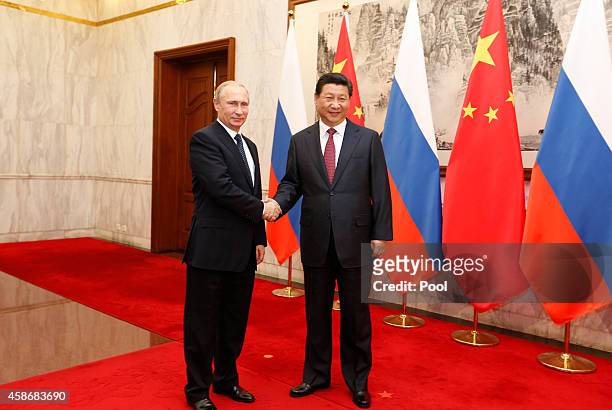 Russian President Vladimir Putin and Chinese President Xi Jinping attend a Bilateral Meeting at the Diaoyutai State Guesthouse during the...