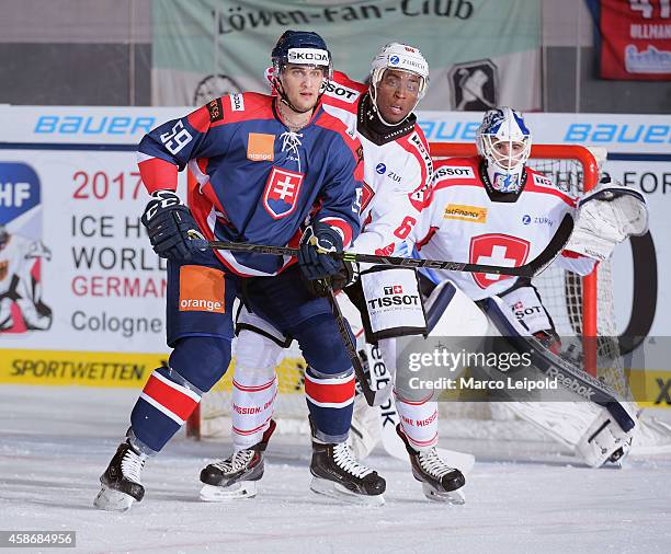 Oldrich Kotvan of Team Slovakia and Clarence Kparghai of Team Switzerland during the game between Slovakia and Switzerland on November 9, 2014 in...