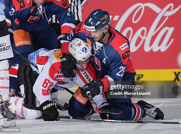 Tristan Scherwey of Team Switzerland imnd Marek Viedensky of Team Slovakia battle during the game between Slovakia and Switzerland on November 9,...