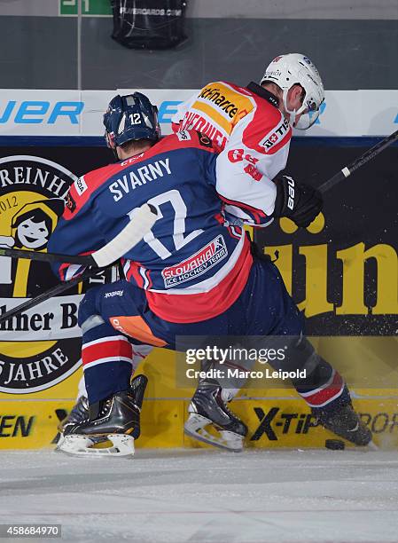 Ivan Svarny of Team Slovakia and Tristan Scherwey of Team Switzerland duel during the game between Slovakia and Switzerland on November 9, 2014 in...