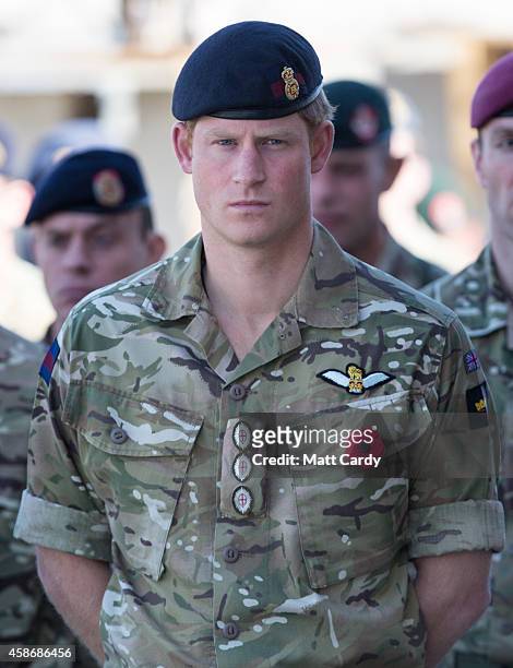 Remembrance poppy adorns the uniform of Prince Harry as he joins British troops and service personal remaining in Afghanistan and also International...