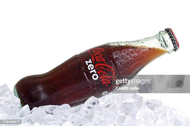 coca-cola zero bottle on ice - cola bottle stock pictures, royalty-free photos & images