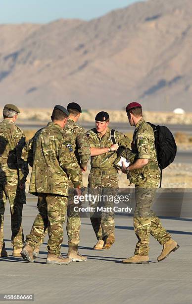 Prince Harry arrives to meet British troops and service personal still remaining in Afghanistan at Kandahar Airfield November 9, 2014 in Kandahar,...