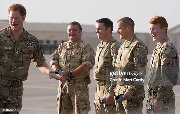 Prince Harry meets with British service personel following a Remembrance Sunday service at Kandahar Airfield November 9, 2014 in Kandahar,...