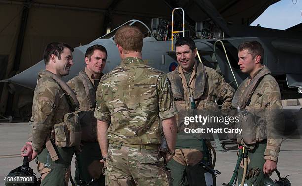 Prince Harry meet pilots of a RAF Tornado following a Remembrance Sunday service at Kandahar Airfield November 9, 2014 in Kandahar, Afghanistan. As...