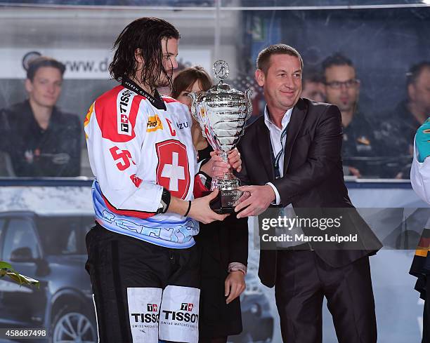 Dino Wieser of Team Switzerland with the cup during the game between Slowakei and Switzerland on November 9, 2014 in Munich, Germany.