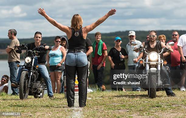 starting the slow race - harley davidson woman stock pictures, royalty-free photos & images