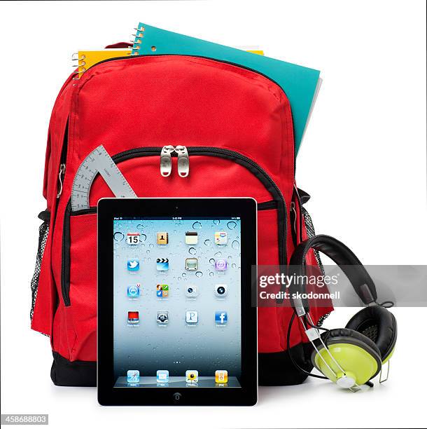 apple ipad on white with a school backpack - apple computers stock pictures, royalty-free photos & images