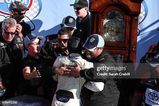 Darrell Wallace, Jr., driver of the 2015 NASCAR Hall of Fame Inductee Wendell Scott Toyota, celebrates in victory lane after winning the NASCAR...