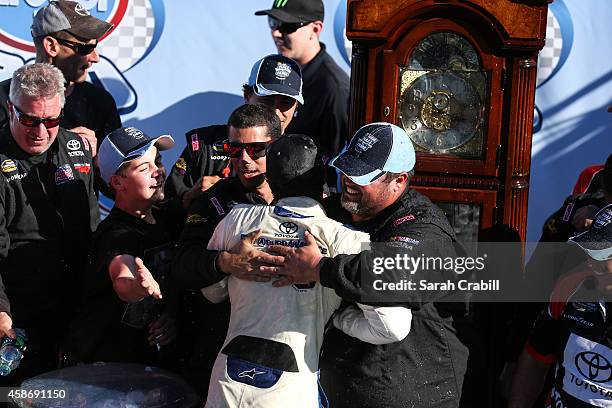 Darrell Wallace, Jr., driver of the 2015 NASCAR Hall of Fame Inductee Wendell Scott Toyota, celebrates in victory lane after winning the NASCAR...