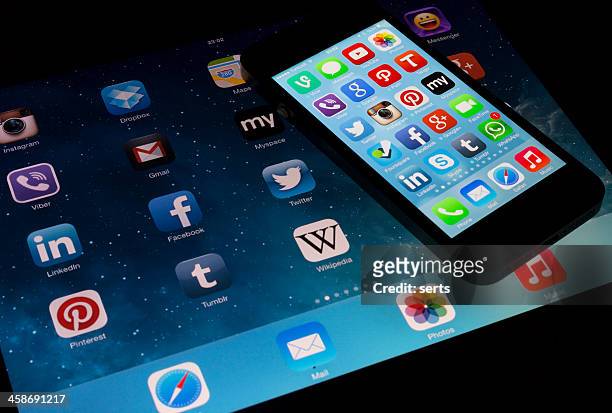 apple ipad & iphone 5 screens app - mobil brand name stock pictures, royalty-free photos & images
