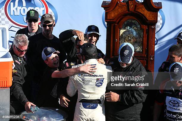 Darrell Wallace, Jr., driver of the 2015 NASCAR Hall of Fame Inductee Wendell Scott Toyota, celebrates in victory lane after winning the NASCAR...