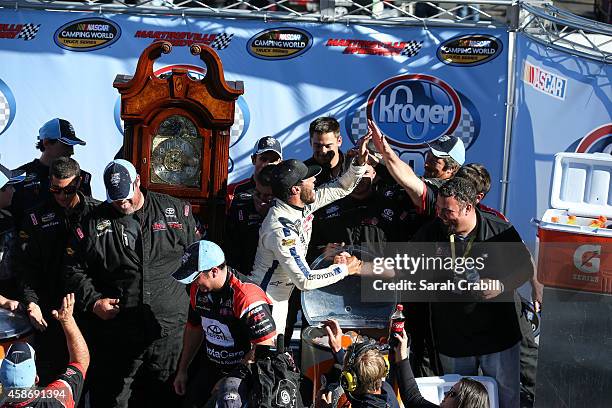 Darrell Wallace, Jr., driver of the 2015 NASCAR Hall of Fame Inductee Wendell Scott Toyota, celebrates in victory lane after winning the NASCAR...