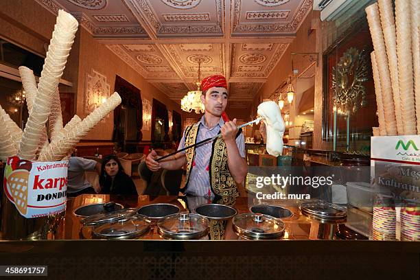 turkish confectioner prepares an ice cream in the tradition way - turkish ethnicity stock pictures, royalty-free photos & images