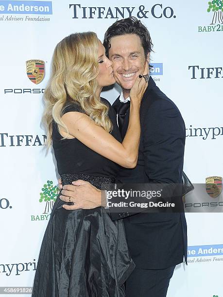 Actor Oliver Hudson and Erinn Bartlett arrive at the 2014 Baby2Baby Gala presented by Tiffany & Co. Honoring Kate Hudson at The Book Bindery on...