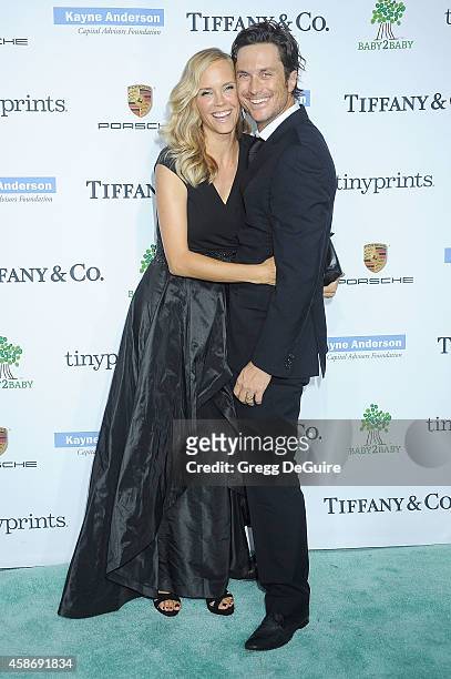 Actor Oliver Hudson and Erinn Bartlett arrive at the 2014 Baby2Baby Gala presented by Tiffany & Co. Honoring Kate Hudson at The Book Bindery on...