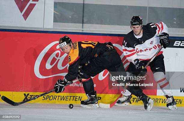 Kai Hospelt of Team Germany and Bud Holloway of Team Canada during the game between Canada and Germany on November 9, 2014 in Munich, Germany.