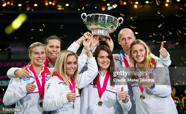 Andrea Hlavackova, Lucie Hradecka, Klara Koukalova, Lucie Safarova, team captain Petr Pala and Petra Kvitova of the Czech Republic pose with trophy...