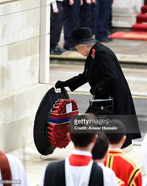 Queen Elizabeth ll lays a wreath during the annual Remembrance Sunday Service at the Cenotaph on November 9, 2014 in London, England.