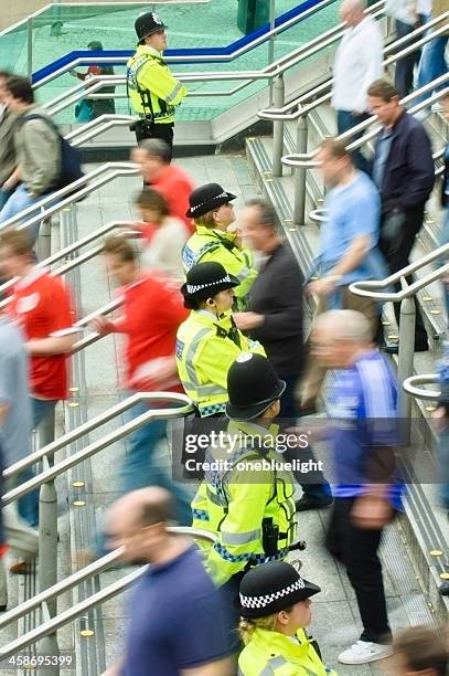 british police ouside tube station - london police stock pictures, royalty-free photos & images