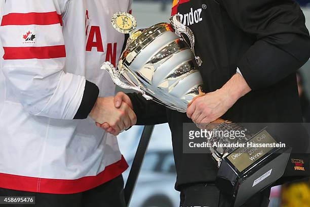 Michael Wolf of Germany shake hand with Steven Reinprecht of Canada after winning the Deutschland Cup 2014 after match 6 of the Deutschland Cup 2014...