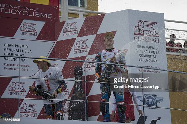 Alex Marquez of Spain and Estrella Galicia 0,0 and Jack Miller of Australia and Red Bull KTM Ajo celebrate on the podium at the end of the Moto3 race...