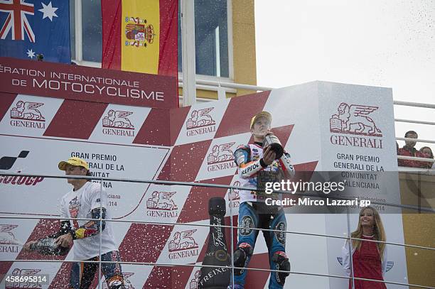 Alex Marquez of Spain and Estrella Galicia 0,0 and Jack Miller of Australia and Red Bull KTM Ajo celebrate on the podium at the end of the Moto3 race...