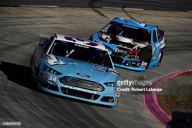 David Ragan, driver of the Wendell Scott Hall of Fame Tribute Ford, races during the NASCAR Sprint Cup Series Goody's Headache Relief Shot 500 at...