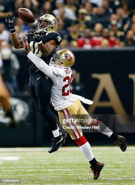 Brandin Cooks of the New Orleans Saints catches a pass in front of Tramaine Brock of the San Francisco 49ers during the second quarter of a game at...