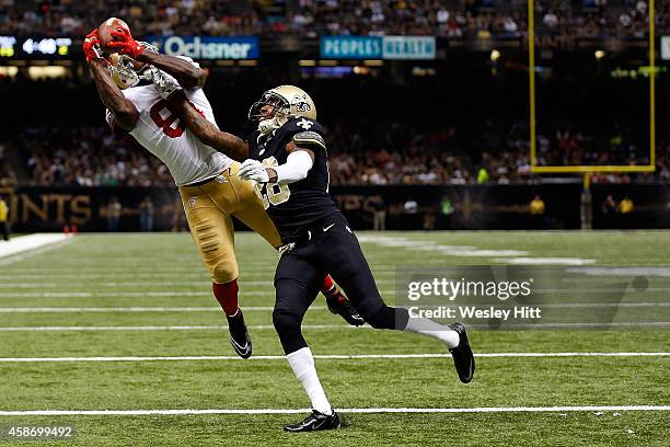 Anquan Boldin of the San Francisco 49ers catches a touchdown pass in front of Keenan Lewis of the New Orleans Saints during the second quarter of a...