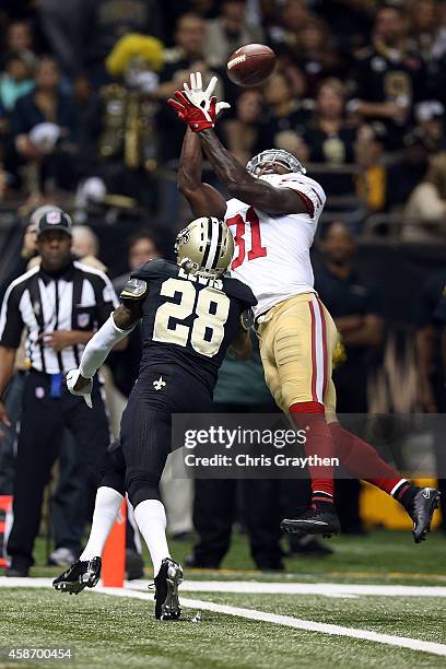 Anquan Boldin of the San Francisco 49ers catches a touchdown pass in front of Keenan Lewis of the New Orleans Saints during the second quarter of a...