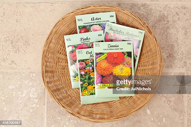 basket of flower seed packets - sachet stockfoto's en -beelden