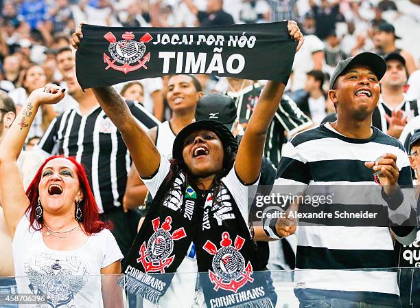 Cheers of Corinthians in action before the match between Corinthians and Santos for the Brazilian Series A 2014 at Arena Corinthians on November 9,...
