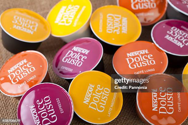 selection of nescafe dolce gusto coffe capsules - nestlé stock pictures, royalty-free photos & images