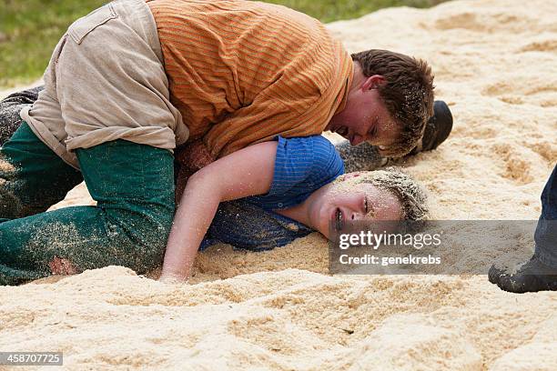 two young boys wrestling, lenk, bernese oberland - boys wrestling stock pictures, royalty-free photos & images