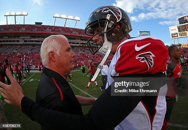 Head coach Mike Smith of the Atlanta Falcons and Matt Ryan shake hands following a game against the Tampa Bay Buccaneers at Raymond James Stadium on...