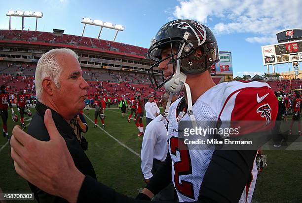 Head coach Mike Smith of the Atlanta Falcons and Matt Ryan shake hands following a game against the Tampa Bay Buccaneers at Raymond James Stadium on...