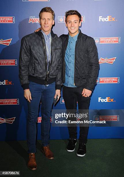 Tom Daley and Dustin Lance Black attend as the Dallas Cowboys play the Jacksonville Jaguars in an NFL match at Wembley Stadium on November 9, 2014 in...