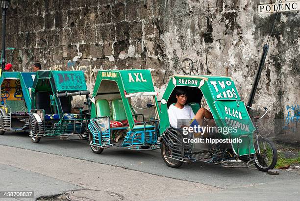 rickshaw driver waiting - fort santiago manila stock pictures, royalty-free photos & images