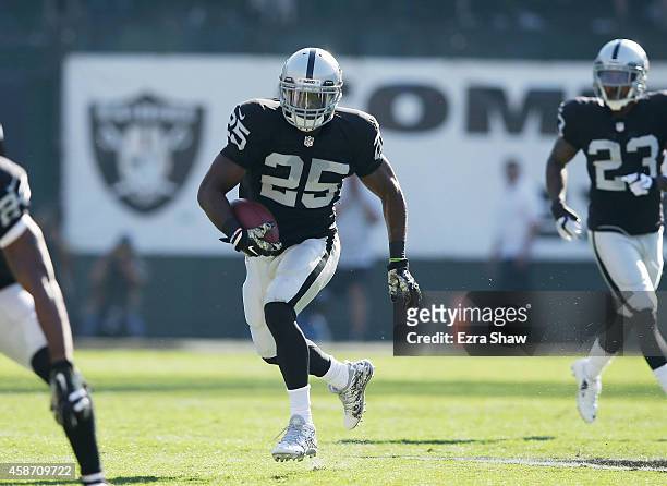 Hayden of the Oakland Raiders carries downfield against the Denver Broncos in the first half at O.co Coliseum on November 9, 2014 in Oakland,...