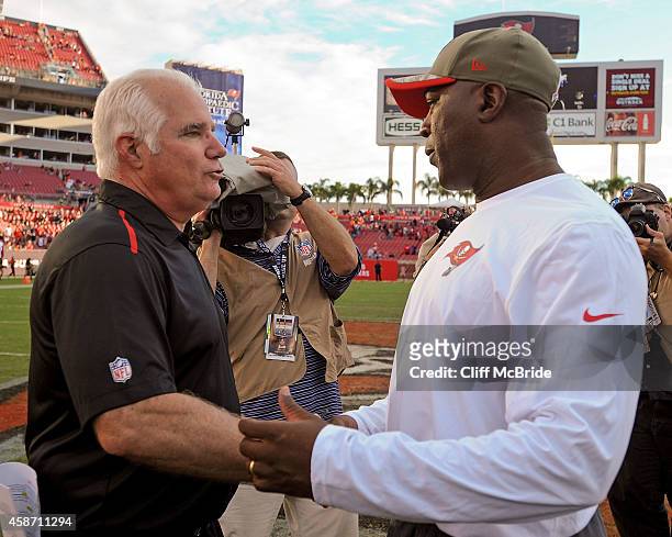 Head coach Mike Smith of the Atlanta Falcons and head coach Lovie Smith of the Tampa Bay Buccaneers shake hands after the game at Raymond James...
