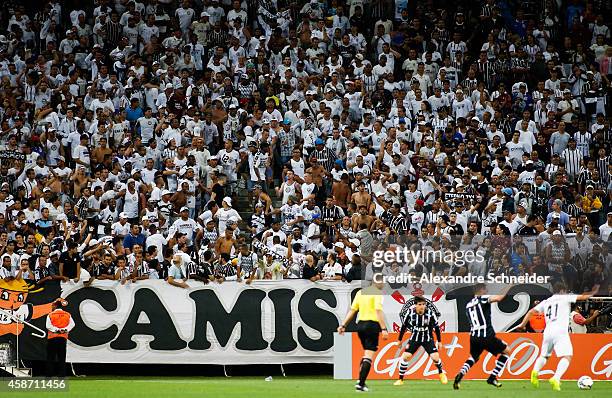 Cheers of Corinthians in action during the match between Corinthians and Santos for the Brazilian Series A 2014 at Arena Corinthians on November 9,...