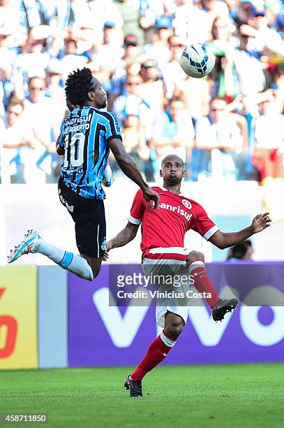 Ze Roberto of Gremio battles for the ball against Wellinton Silva of Internacional during match between Gremio and Internacional as part of...