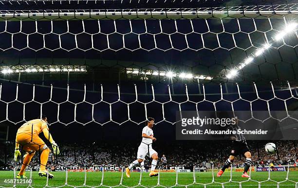 Guerrero of Corinthians scores their first goal during the match between Corinthians and Santos for the Brazilian Series A 2014 at Arena Corinthians...