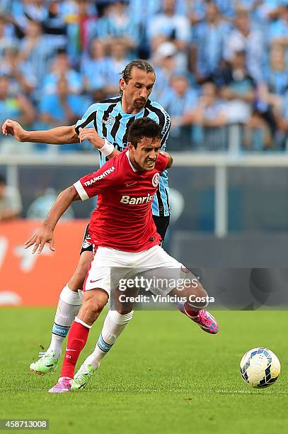 Hernan Barcos of Gremio battles for the ball against Alan Ruschel of Internacional during match between Gremio and Internacional as part of...