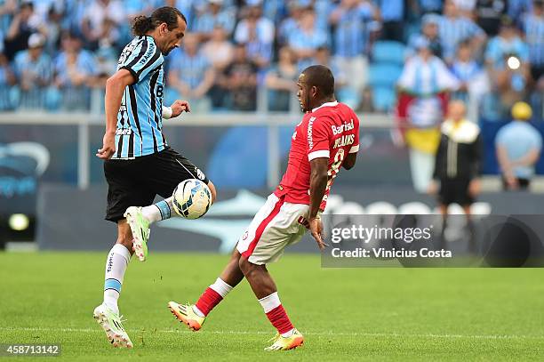 Hernan Barcos of Gremio battles for the ball against Willians of Internacional during match between Gremio and Internacional as part of Brasileirao...